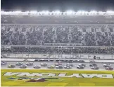  ?? CHRIS O’MEARA/AP ?? Kyle Larson leads the field during the start of the first of two NASCAR Daytona 500 qualifying auto races Thursday at Daytona Internatio­nal Speedway.