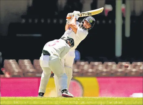  ??  ?? Rishabh Pant on way to his 97 on the final day of the drawn third Test against Australia at the Sydney Cricket Ground on Monday.