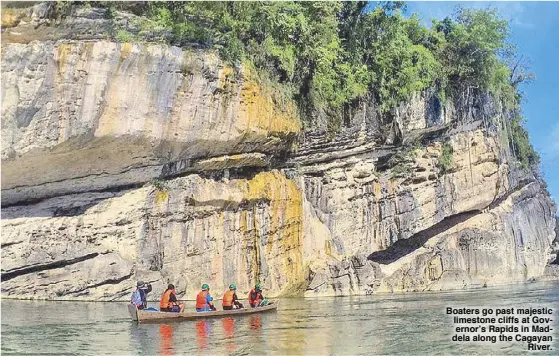  ??  ?? Boaters go past majestic limestone cliffs at Governor’s Rapids in Maddela along the Cagayan River.