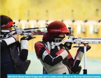 ?? — AFP ?? NEW DELHI: Shimaa Hashad of Egypt takes part in a pratice session with an air rifle at the Internatio­nal Shooting Sport Federation (ISSF) World Cup at Dr. Karni Singh Shooting Range in New Delhi yesterday.