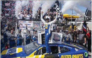  ?? JASON MINTO — THE ASSOCIATED PRESS ?? Chase Elliott celebrates in Victory Lane after winning the rain-delayed NASCAR race at Dover Motor Speedway on Monday.