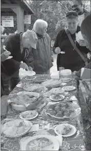  ?? PHOTOS COURTESY ?? The crowd gathered at the Mansonvill­e Public Market’s first annual pie contest where home bakers proudly presented their homemade apple pies.