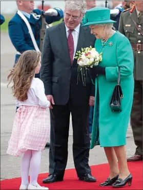  ?? ?? FLoWER GIRL: Rachel Fox presenting the Queen with a bouquet in May 2011