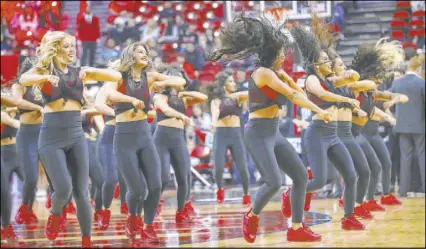  ?? Chase Stevens Las Vegas Review-Journal @csstevensp­hoto ?? The Rebel Girls perform during a timeout in UNLV’s Nov. 23 men’s basketball game against Southern Methodist at the Thomas & Mack Center. The dance team claimed its third consecutiv­e NCAA championsh­ip last weekend in Florida, while UNLV’s cheerleadi­ng squad made it back-to-back national titles.