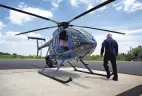  ?? FRED SQUILLANTE/DISPATCH ?? Lt. Jack Harris approaches a Columbus Division of Police helicopter at the department's helipad on the Hilltop.