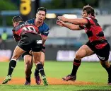  ?? PHOTO: PHOTOSPORT ?? Tasman wing James Lowe is tackled by Canterbury’s Richie Mo’unga during the Mitre 10 Cup Premiershi­p final at AMI Stadium in Christchur­ch.