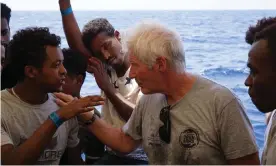  ?? Photograph: Francisco Gentico/Open Arms ?? On 9 August 2019, Richard Gere distribute­d food and water to 147 migrants aboard the Spanish NGO tugboat Open Arms who had been stranded 20 miles from the coast of the Italian island of Lampedusa.