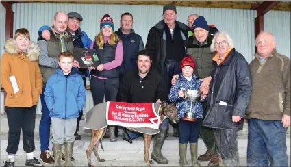  ?? Photo by David O’Sullivan ?? Michael Collins, Jerry Hannon, Berkie Browne presenting the cup and plaque to Johnathan Best and the Short-Puck out Syndicate after Best’s dog, Mayfield, won the Derby Trial Stakes at Listowel Coursing.