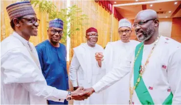  ??  ?? President Muhammadu Buhari introduces Gov. Mai Mala Buni of Yobe State (left) to President George Weah of Liberia (right), during Liberia’s 172nd Independen­ce Anniversar­y in Monrovia at the weekend. With them are Governor Kayode Fayemi of Ekiti State (third right) and Governor Abdurrazak of Kwara State