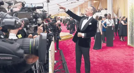  ?? JORDAN STRAUSS/INVISION ?? Tom Hanks arrives at the Oscars on Feb. 9 in Los Angeles. This time of year would normally be flush with splashy premieres, cocktail parties and star-studded screening.