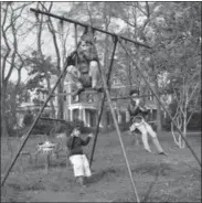  ?? KENNEDY FAMILY COLLECTION — JOHN F. KENNEDY LIBRARY FOUNDATION
VIA AP ?? In this October 1934photo provided by the Kennedy Family Collection, courtesy of the John F. Kennedy Library Foundation, Robert F. Kennedy, top front, Edward M. Kennedy, left rear, and Jean Kennedy, right rear, play on a swing set in Bronxville, N.Y.