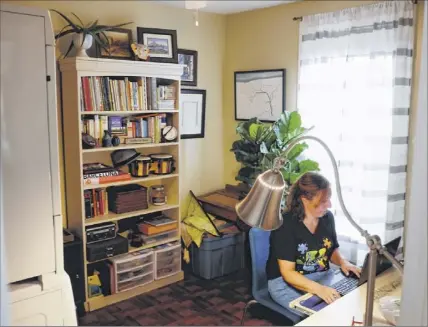  ?? Paul Buckowski / times union ?? Violetta derosa, a teaching assistant, special education, for the Albany School district, works in her office at her home in Albany. this is where derosa would work with students and families when doing remote learning.