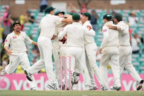  ?? PICTURE: GETTY IMAGES ?? JOVIAL: The Australian team celebrate victory during day four of the second Test after beating India by an innings and 68 runs in Sydney today.