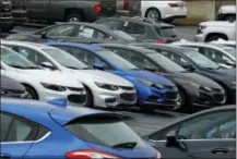  ?? THE ASSOCIATED PRESS ?? Chevrolet cars are parked on the lot of a dealer in Pittsburgh.