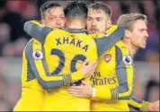  ?? AP ?? Arsenal's Mesut Ozil (left) celebrates with teammates after scoring against Middlesbro­ugh on Monday.