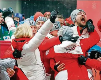  ?? [ANDY WONG/THE ASSOCIATED PRESS] ?? David Gleirscher of Austria (right) shouts after winning the gold medal in the men’s luge competitio­n at the Winter Olympics Sunday in Pyeongchan­g, South Korea.