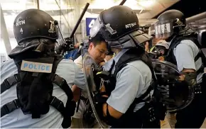  ?? AP ?? Protesters and police fought in Hong Kong airport on Tuesday, in one of the most violent clashes in months of protest.