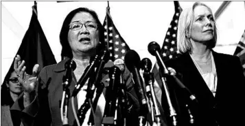  ?? ALEX WONG/GETTY ?? Sens. Mazie Hirono and Kirsten Gillibrand defend Christine Blasey Ford on Thursday. Ford has accused nominee Brett Kavanaugh of sexual assault at a high school party in the ’80s.