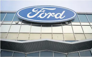  ?? REUTERS ?? The Ford Motor Co logo is seen outside its Halewood transmissi­ons plant in Liverpool, Britain.