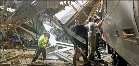  ??  ?? Smash: The New Jersey train ploughed through the buffers at Hoboken station and into a wall with such force it brought down the roof