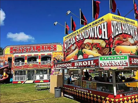  ?? FILE PHOTO ?? Food and fun rides are two of the main attraction­s at the Washington County Fair.