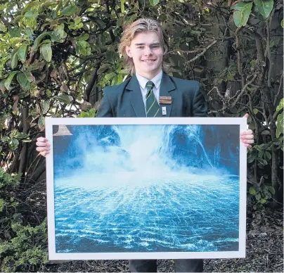  ?? PHOTO: LUISA GIRAO ?? Giving it his best shot . . . Aparima College pupil Dom Riddell displays one of the photograph­s he took at Milford Sound.