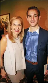  ??  ?? Fran Margulies of Havertown and her son, Austin, make their way to the dining room as the luncheon begins.