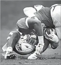  ?? JOHN J. KIM/CHICAGO TRIBUNE PHOTOS ?? Safeties first: Duke safety Michael Carter II (top) breaks up a pass intended for Northweste­rn’s JJ Jefferson in the first quarter. In the third, Duke safety Dylan Singleton (above) stops NU’s Jeremy Larkin.