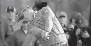  ??  ?? Chris Carlson / The Associated Press Charley Hoffman drives from the 18th tee Thursday during the opening round of the Masters.