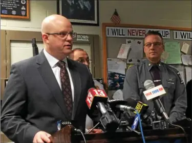  ?? PAUL POST — PPOST@DIGITALFIR­STMEDIA.COM ?? Rensselaer County District Attorney Joel Abelove describes the murders of four Troy residents as “savagery and barbarism” during a Saturday press conference as state police Troop G commander Major Robert Patnaude, right, looks on.