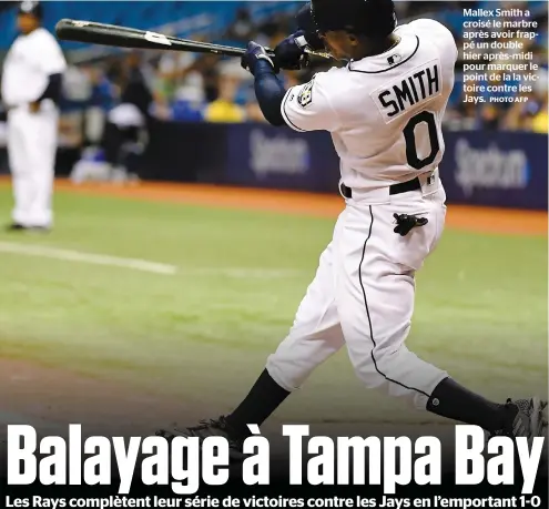  ?? PHOTO AFP ?? Mallex Smith a croisé le marbre après avoir frappé un double hier après-midi pour marquer le point de la la victoire contre les Jays.