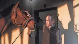  ?? MATT STONE/THE COURIER JOURNAL ?? Trainer Whit Beckman, who trains 2024 Kentucky Derby contender Honor Marie, is seen at his barn Wednesday morning, at Churchill Downs in Louisville, Ky.