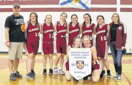  ?? AMY TUDOR PHOTO ?? The Islands Consolidat­ed School team with their regionals championsh­ip banner. Pictured are (Back row) Coach Mike Thimot, Rhynda Tudor, Myia Brown, Bella Titus, Madison Lent, Jayden Lewis, Katie Moore, Coach Jessica Thimot, (Front row) Lauren Sollows and Gracie Frost.