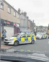  ??  ?? Rapid response Police attend scene of last month’s armed robbery in Green Street