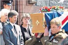  ??  ?? Reg Keys and his family at the funeral of his 20-year-old son Tom who was killed in 2003