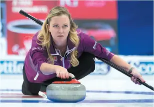  ?? CP PHOTO ?? Skip Chelsea Carey delivers a rock during an Olympic curling trials game against Team Jones on Wednesday in Ottawa.