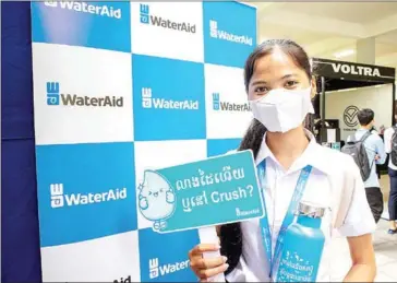  ?? WASH EXHIBITION AT TECHNO IN ?? A student attends a WASH exhibition at Green Career Fair held at the Institute of Technology of Cambodia (ITC) in May.