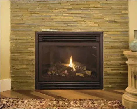  ?? CONSTANTGA­RDENER/GETTY ?? Regular cleaning and inspection are crucial to maintainin­g a gas fireplace.