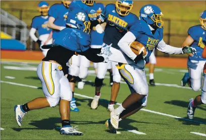  ?? CHRIS RILEY — TIMES-HERALD ?? The Benicia High School football team runs through drills during practice on Tuesday. The Panthers take on Campolindo on Friday in the season opener.