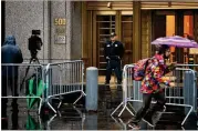  ?? RICK LOOMIS / GETTY IMAGES ?? A police officer watches over the entrance to the United States Courthouse in New York ahead of the appearance by alleged mail bomber Cesar Sayoc. Sayoc is accused of sending pipe bombs to prominent Democrats and critics of President Donald Trump.