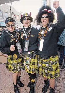  ?? RYAN REMIORZ THE CANADIAN PRESS FILE PHOTO ?? Grey Cup fans Shawn Nugent, left, Jason Allan and Gus Georgakoul­ias from Hamilton, take part in the festivitie­s at the Calgary Grey Cup pancake breakfast in Regina in 2003.