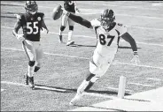  ?? Andy Cross / The Denver Post ?? Broncos tight end Noah Fant scores a touchdown pass against the Steelers’ Devin Bush on Sunday at Heinz Field in Pittsburgh.