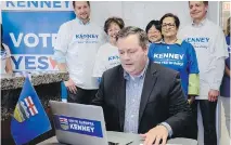  ??  ?? Jason Kenney votes by computer in the PC Referendum on Unity at his campaign office in Calgary. JEFF MCINTOSH/THE CANADIAN PRESS