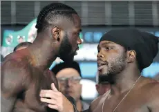  ?? ABBIE PARR/GETTY IMAGES ?? Deontay Wilder, left, and Bermane Stiverne stare each other down during the official weigh-in for Saturday’s fight.