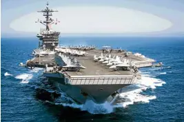  ?? —AFP ?? BATTLE-READY This US Navy handout photo shows the aircraft carrier USS Theodore Roosevelt as it transits the Pacific Ocean.