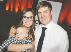  ??  ?? Harriet Ronoghan, Courage to Come Back awardee, with her husband Tyler and son Charlie.