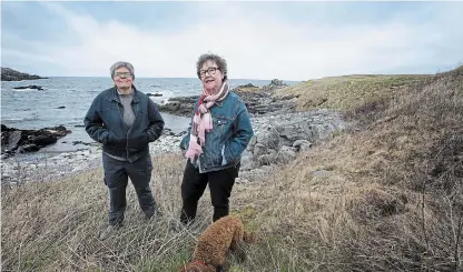  ?? PAUL DALY THE CANADIAN PRESS ?? Wanda Crocker, left, and Gerry Rogers live in Broad Cove, N.L., where about 30 lesbians have been settling or summering for the past three decades.