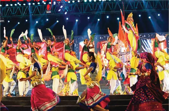  ?? — AFP ?? Indian folk dancers perform during the full dress rehearsal on the eve of Vibrant Navratri Mahotsav at the GMDC ground. Folk dancers from across India are participat­ing in the Vibrant Navratri Mahotsav as the Hindu ‘Navratri’ - the ‘Dance Festival of...