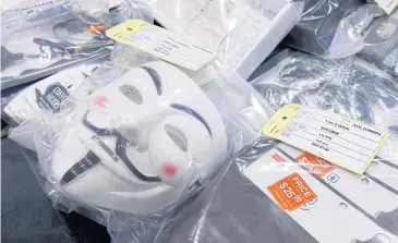 ?? REUTERS ?? A Guy Fawkes mask is seen among other evidence displayed during a news conference after Hong Kong police’s National Security Department arrested nine people for ‘suspected terrorist activities’ yesterday.