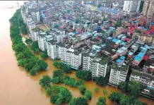 ?? LI HANCHI / FOR CHINA DAILY ?? Floodwater­s from the Liujiang River soak part of Liuzhou in the Guangxi Zhuang autonomous region on Tuesday. It was the third flood in the city since June 29.